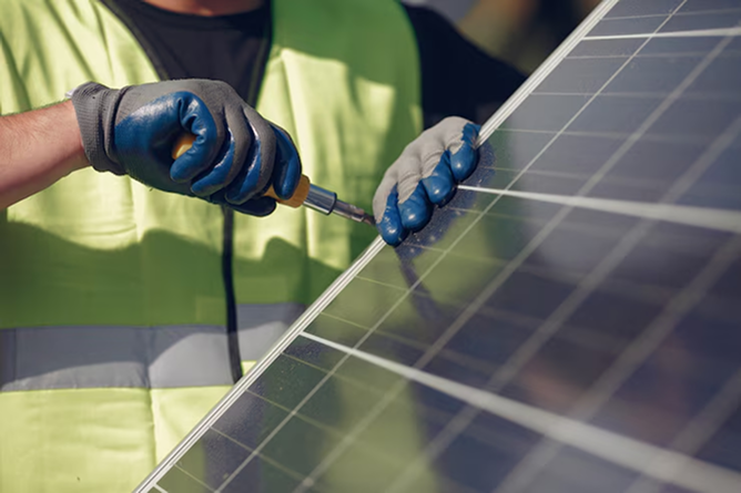 Technician Working on Solar Panel